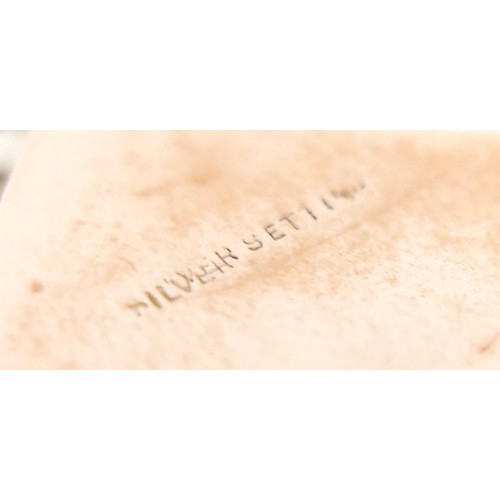 14 - A ruby-set gilt metal locket, 3cm square, marked '9ct gold back & front' and stamped 'silver setting... 