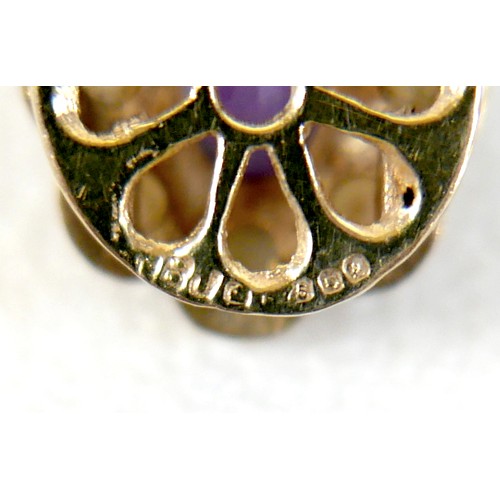 47 - A twin strand pearl necklace with 9ct gold clasp set with faceted amethyst.