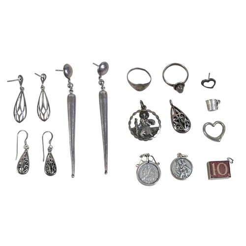 35 - A collection of silver jewellery including an ingot, rings and charms, total weight 7.4 troy oz.(1 b... 