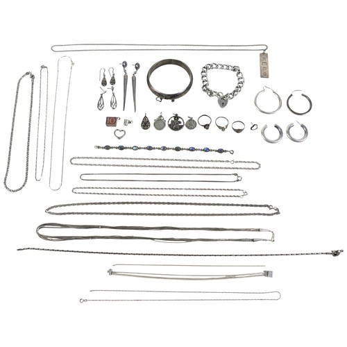 35 - A collection of silver jewellery including an ingot, rings and charms, total weight 7.4 troy oz.(1 b... 