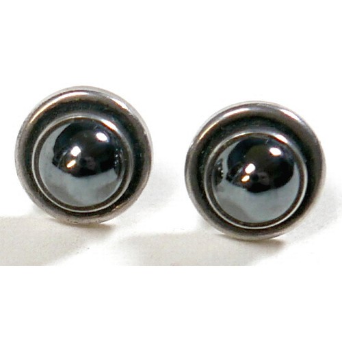 25 - Georg Jensen - a pair of stud earrings and a ring designed by Harald Nielsen; the circular stud earr... 