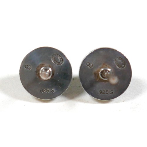25 - Georg Jensen - a pair of stud earrings and a ring designed by Harald Nielsen; the circular stud earr... 
