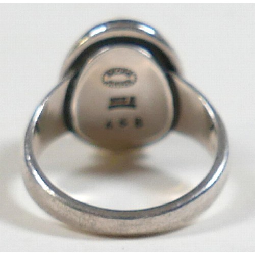 25 - Georg Jensen - a pair of stud earrings and a ring designed by Harald Nielsen; the circular stud earr... 