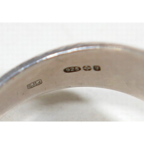 25 - Georg Jensen - a pair of stud earrings and a ring designed by Harald Nielsen; the circular stud earr... 