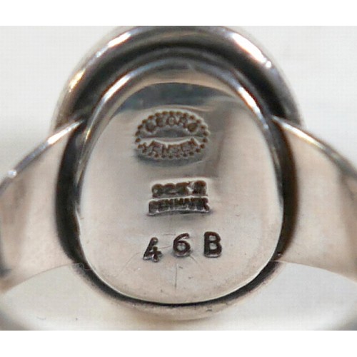 25 - Georg Jensen - a pair of stud earrings and a ring designed by Harald Nielsen; the circular stud earr... 