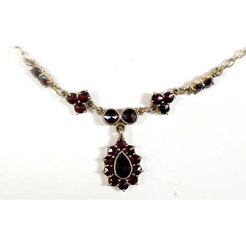 50 - A 9ct yellow gold garnet necklace and a pair of 9ct yellow gold screw back garnet earrings, necklace... 