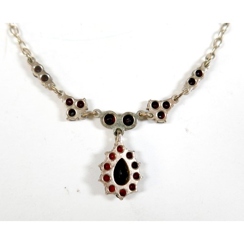 50 - A 9ct yellow gold garnet necklace and a pair of 9ct yellow gold screw back garnet earrings, necklace... 