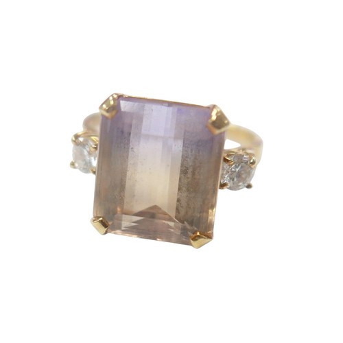 76 - An 18ct yellow gold bi-colour tourmaline and diamond ring the central stone approximately 6ct flanke... 