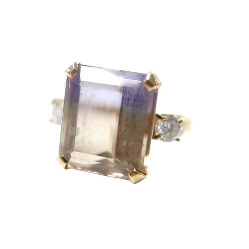 76 - An 18ct yellow gold bi-colour tourmaline and diamond ring the central stone approximately 6ct flanke... 