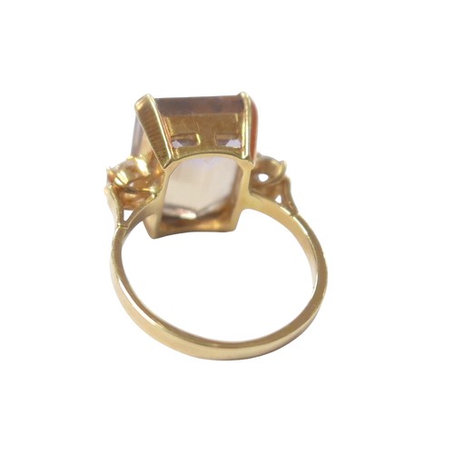 76 - An 18ct yellow gold bi-colour tourmaline and diamond ring the central stone approximately 6ct flanke... 