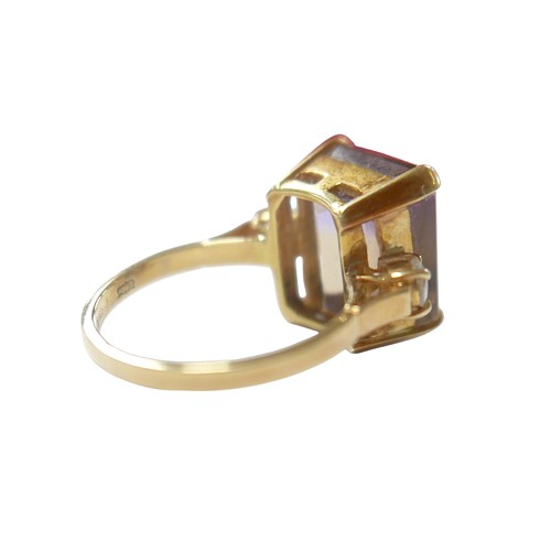 76 - An 18ct yellow gold bi-colour tourmaline and diamond ring the central stone approximately 6ct flanke... 