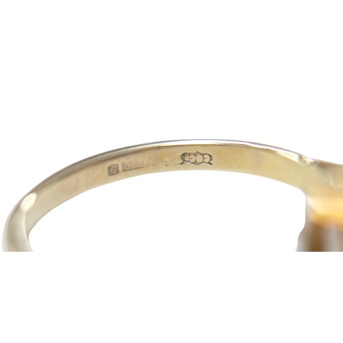 76 - An 18ct yellow gold bi-colour tourmaline and diamond ring the central stone approximately 6ct flanke... 