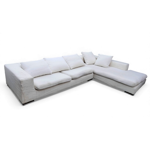 398 - A Roche Bobois long beach corner sofa, upholstered in white fabric, each section 104 by 225 by 57cm ... 