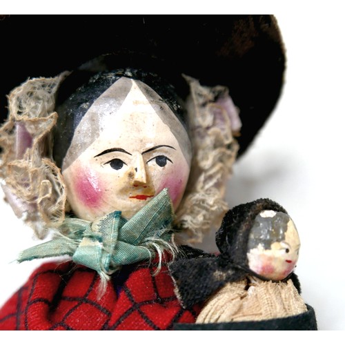 19 - Three early 20th century peg dolls, including two in traditional Welsh dress, tallest 32cm, as well ... 