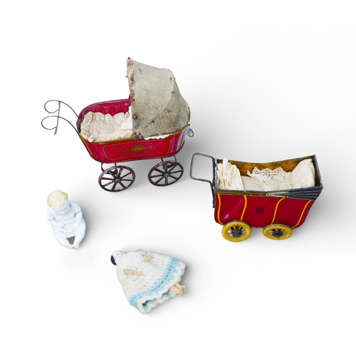 50 - Two early 20th century Wells tinplate toy prams, the largest with a cloth canopy, 17 by 8.5 by 16cm ... 
