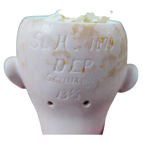 26 - A large Simon & Halbig doll, with glass eyes, painted features, open mouth with an upper row of porc... 