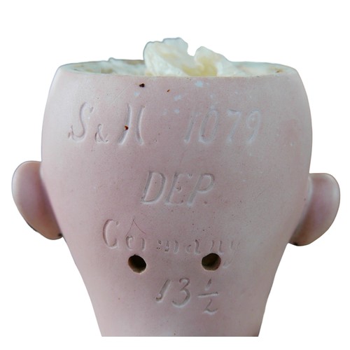 27 - A large Simon & Halbig doll, with glass eyes, painted features, an open mouth with an upper row of p... 