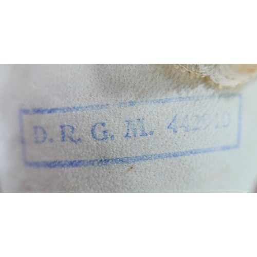 33 - An early 20th century Hertwig & Schwab style bisque headed baby doll, with sleepy eyes, hand painted... 