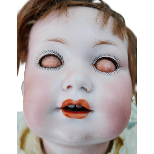 34 - An early 20th century Armand Marseilles bisque headed doll, with sleepy eyes, hand painted eyelashes... 