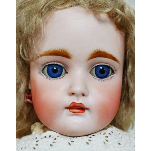 35 - A late 19th century/early 20th century continental bisque headed doll, with sleepy eyes, hand painte... 