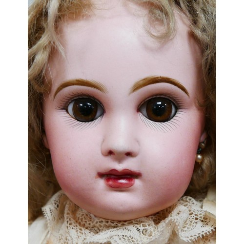 39 - A bisque headed Jumeau doll, with glass eyes, hand painted eye lashes, eye brows and lips, closed mo... 