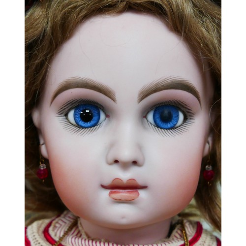 40 - A Bruno Schmidt bisque headed doll, with glass eyes, hand painted eyelashes, eyebrows and lips, clos... 