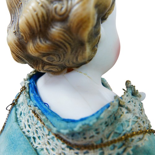 42 - A late 19th century/early 20th century bisque headed doll, with moulded hair, hand painted features,... 