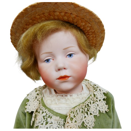 43 - An early 20th century Kämmer & Reinhardt bisque headed doll, with hand painted blue eyes, eyebrows a... 