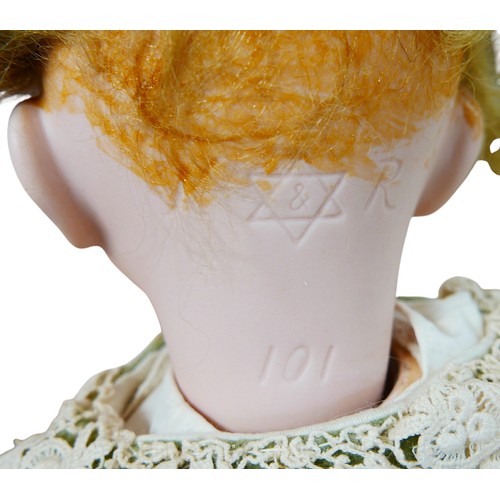 43 - An early 20th century Kämmer & Reinhardt bisque headed doll, with hand painted blue eyes, eyebrows a... 