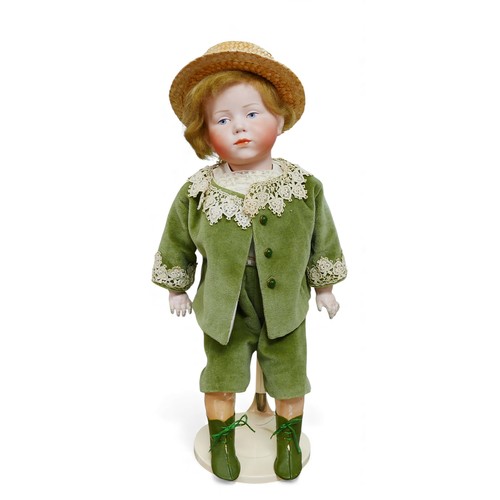 43 - An early 20th century Kämmer & Reinhardt bisque headed doll, with hand painted blue eyes, eyebrows a... 