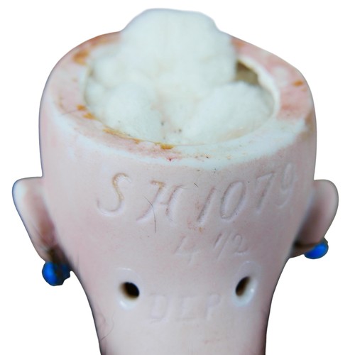 46 - An early 20th century Simon & Halbig bisque headed doll, impressed marks to the back of its head 'SH... 