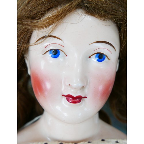 49 - A 19th century German porcelain headed doll, possibly by Lippert & Haas, with hand painted face, and... 