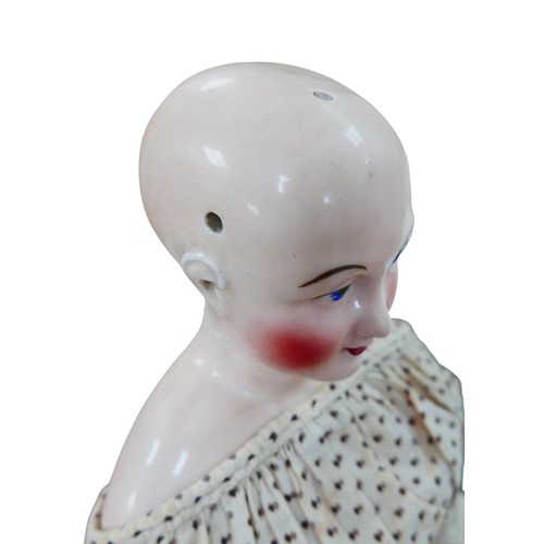 49 - A 19th century German porcelain headed doll, possibly by Lippert & Haas, with hand painted face, and... 