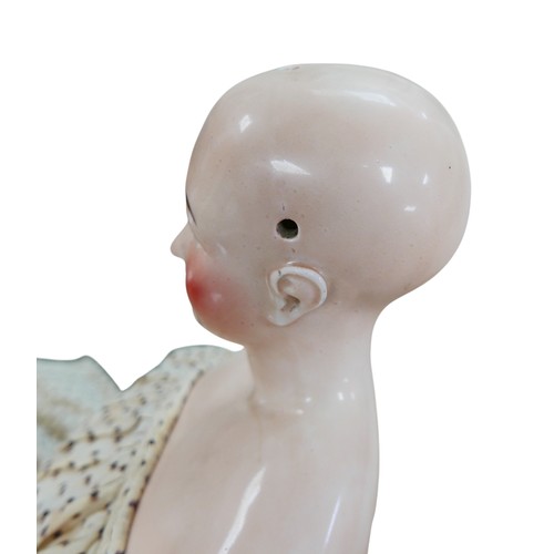 49 - A 19th century German porcelain headed doll, possibly by Lippert & Haas, with hand painted face, and... 