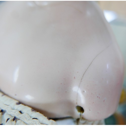 49 - A 19th century German porcelain headed doll, possibly by Lippert & Haas, with hand painted face, and... 