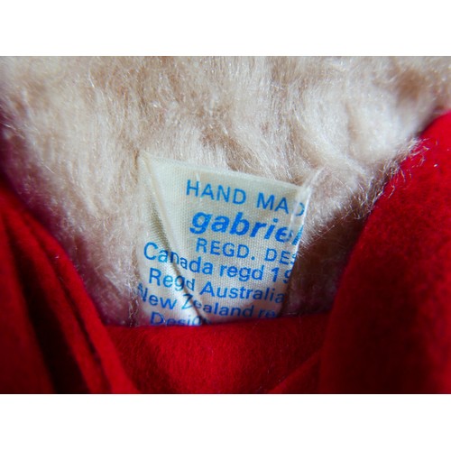 18 - A Gabrielle Designs Paddington bear, with Dunlop boots, 47cm high overall, and eight smaller bears i... 