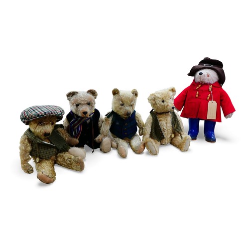 8 - A Gabrielle Designs Paddington bear, with Dunlop boots, a homemade name label, 46cm high, and four o... 