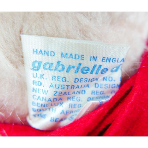 15 - A Gabrielle Designs Paddington bear, with Dunlop boots and name tag, 46cm high, together with six ot... 
