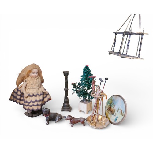 67 - A group of doll's house accessories, including three figures, a mangle, umbrella stand, and dogs. (1... 