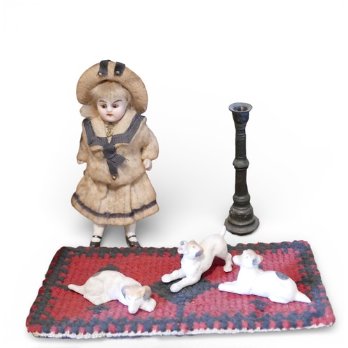 67 - A group of doll's house accessories, including three figures, a mangle, umbrella stand, and dogs. (1... 