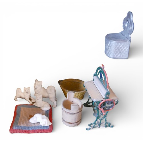 67 - A group of doll's house accessories, including three figures, a mangle, umbrella stand, and dogs. (1... 