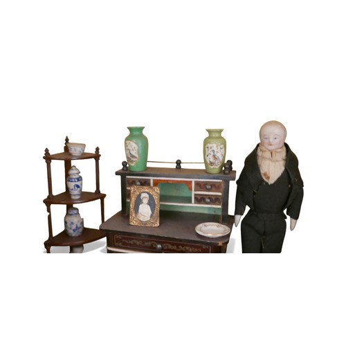 70 - Six dolls and assorted doll's house furnishings, including a piano, some Chinese blue and white cera... 