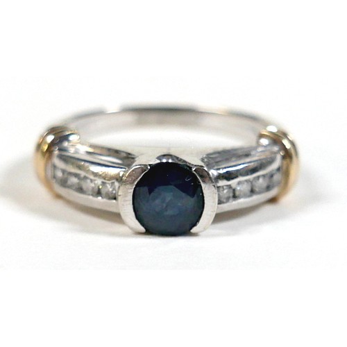 156 - An 18ct gold sapphire and diamond ring, the central round cut sapphire approximately 5mm diameter, w... 