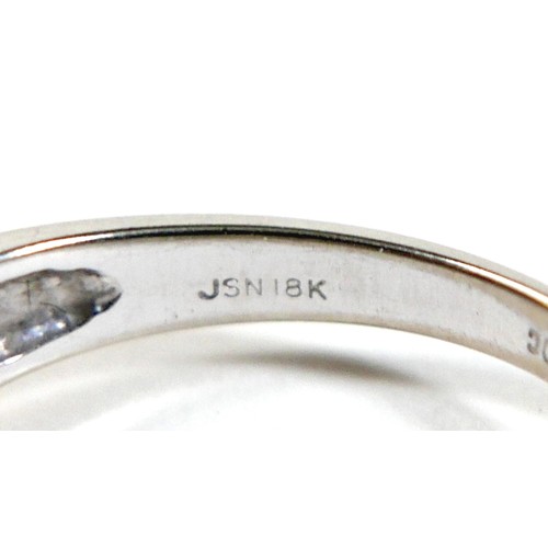 156 - An 18ct gold sapphire and diamond ring, the central round cut sapphire approximately 5mm diameter, w... 