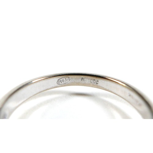 156 - An 18ct gold sapphire and diamond ring, the central round cut sapphire approximately 5mm diameter, w... 