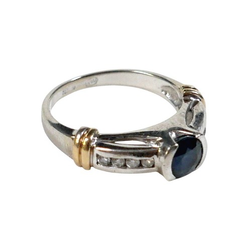 156 - An 18ct gold sapphire and diamond ring, the central round cut sapphire approximately 5mm diameter, w... 