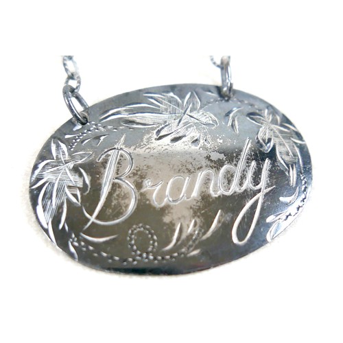 158 - Two Elizabeth II silver decanter labels, inscribed 'Brandy' and 'Whisky', Birmingham 1976 and 1978, ... 