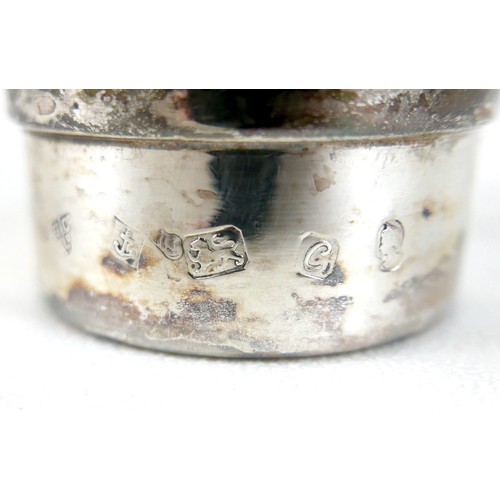 170 - A pair of Elizabeth II silver hurricane lamps with a rose column on a weighted circular footed base ... 