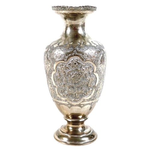 169 - A white metal eastern vase and two small silver top glass pots, the vase of baluster form decorated ... 