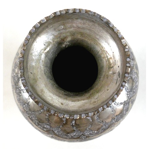 169 - A white metal eastern vase and two small silver top glass pots, the vase of baluster form decorated ... 